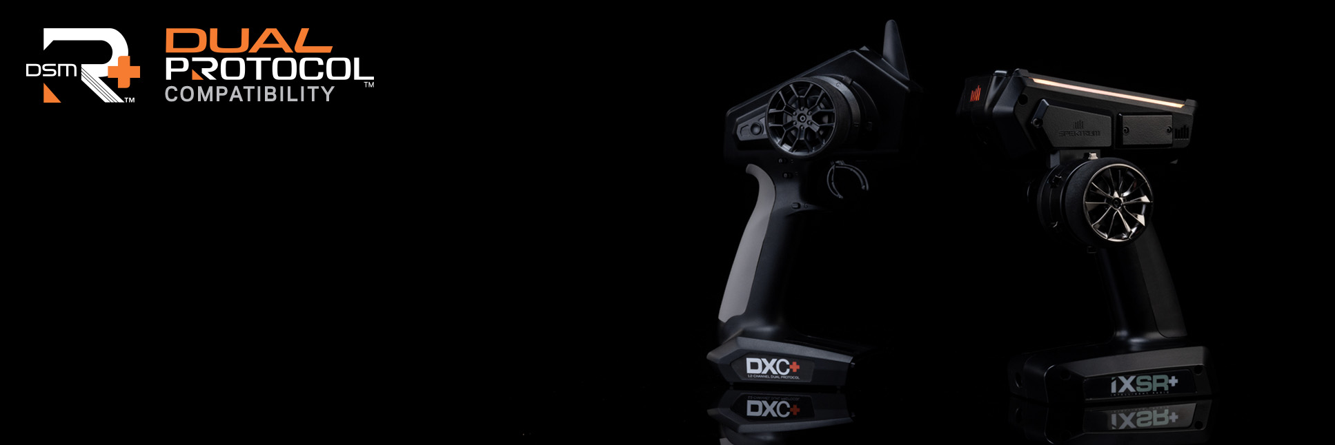 Glamour shot Spektrum DXC+ and iSXR+ 12-Channel DSMR+ Transmitters on a black background with the DSMR+ and Dual Protocol Logo Glamour shot Spektrum DXC+ and iSXR+ 12-Channel DSMR+ Transmitters on a black background with the DSMR+ and Dual Protocol Logo