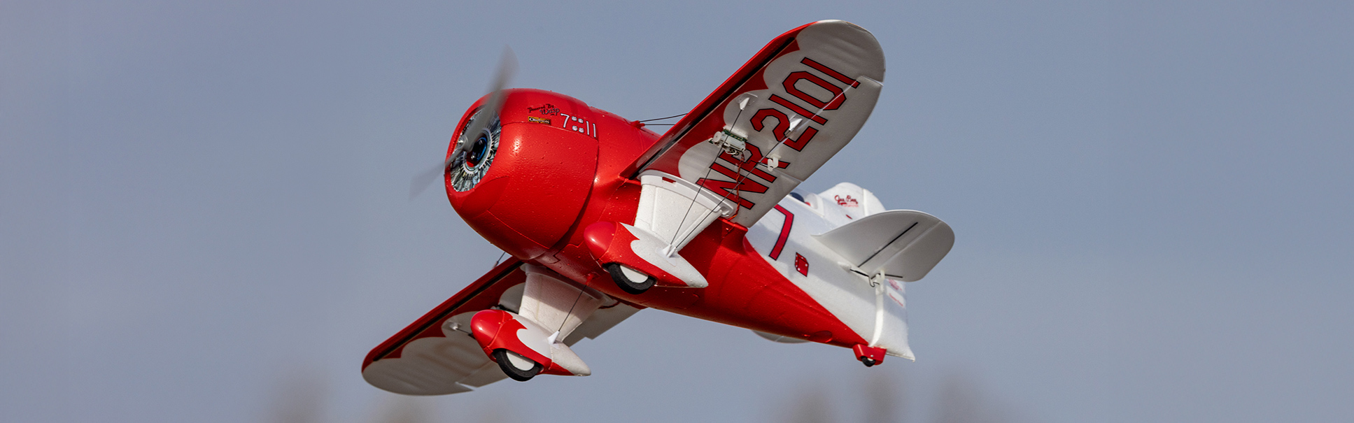Action shot of the E-flite UMX Gee Bee R-2 510mm Bind-N-Fly Basic RC Airplane with AS3X and SAFE Select flying through the sky