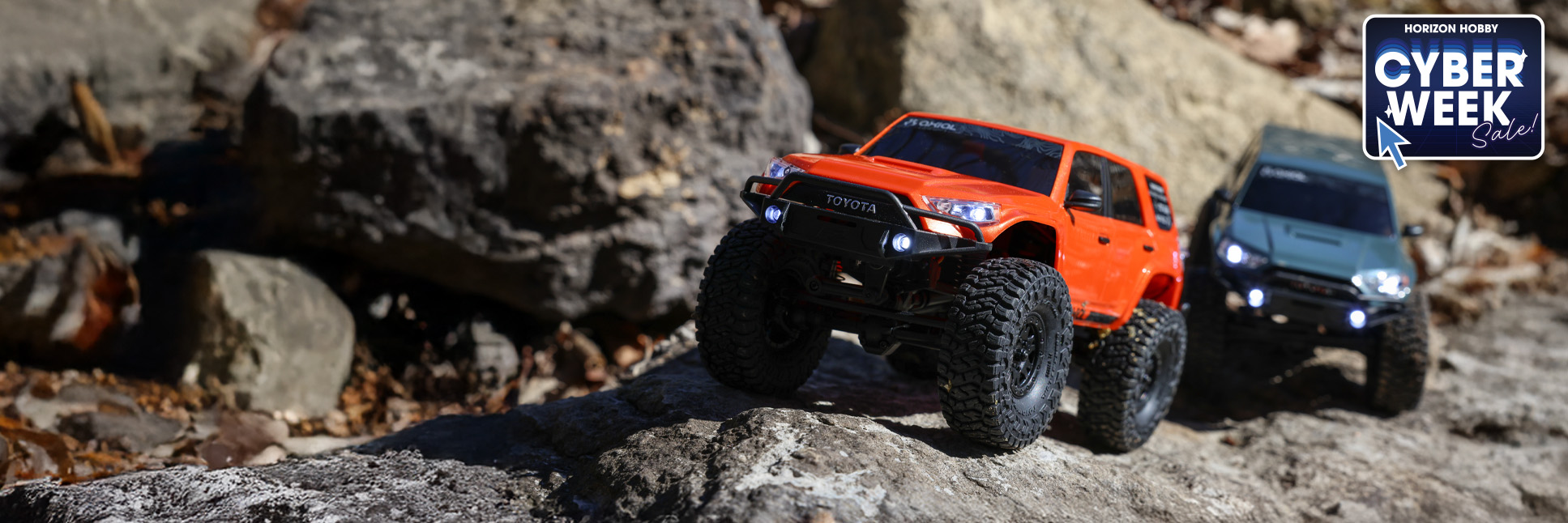 Action shot of the Axial 1/24 SCX24 Dodge Power Wagon 4X4 RTR Brushed Rock Crawler with the Cyber Week Sale logo Action shot of the Axial 1/24 SCX24 Dodge Power Wagon 4X4 RTR Brushed Rock Crawler with the Cyber Week Sale logo