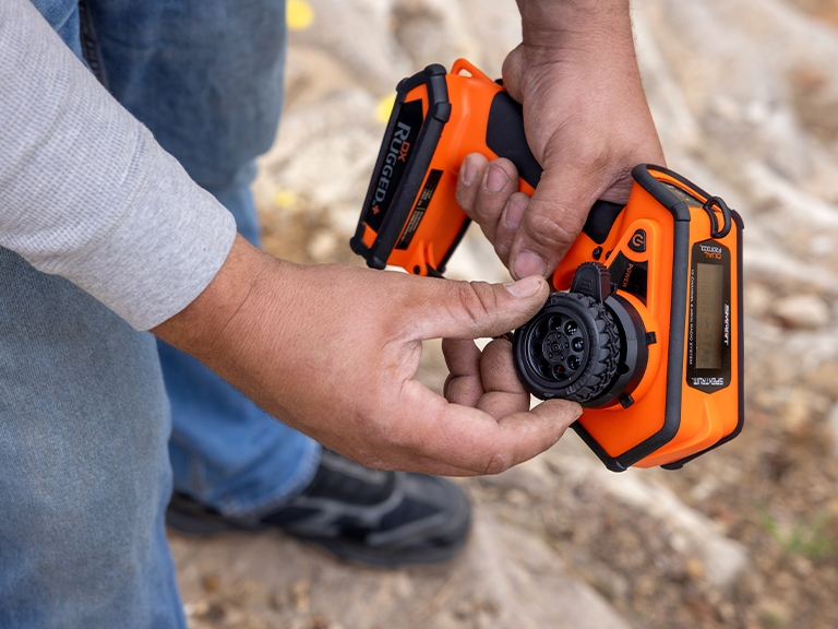 Lifestyle shot of the Spektrum DX+ 12-Channel DSMR+ Transmitter, Orange