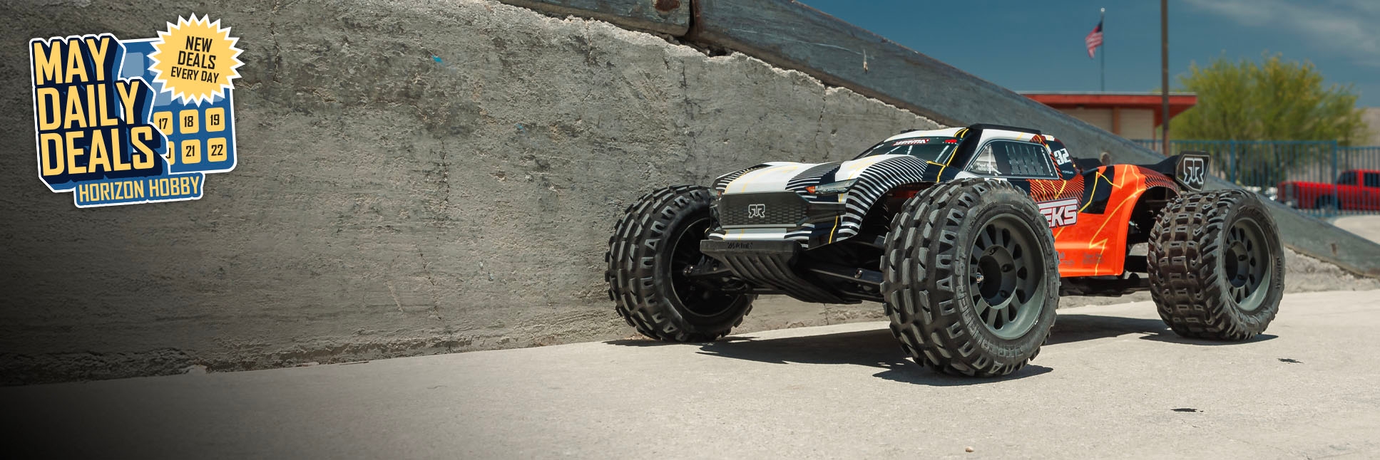 Action shot of ARRMA 1/10 VORTEKS 2WD RTR Brushed RC Stadium Truck with the May Daily Deals Logo