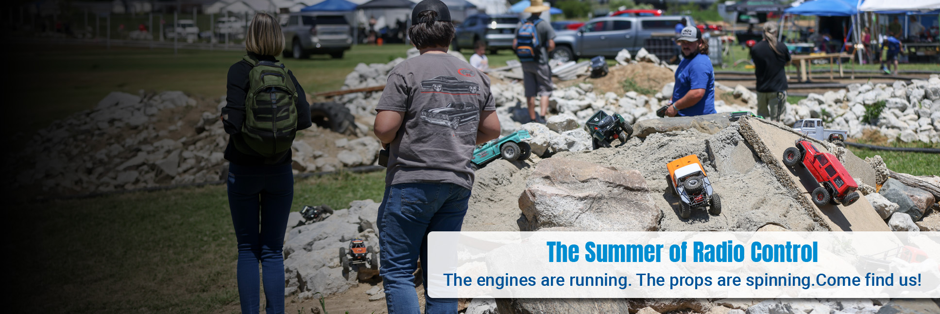 Action shot of a group of people enjoying their RC rock crawlers at an outdoor event Action shot of a group of people enjoying their RC rock crawlers at an outdoor event