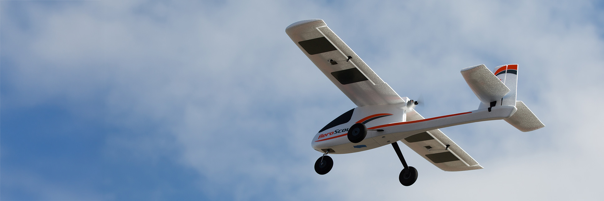 Action shot of the HobbyZone AeroScout S 2 1.1m RC airplane flying through the sky Action shot of the HobbyZone AeroScout S 2 1.1m RC airplane flying through the sky