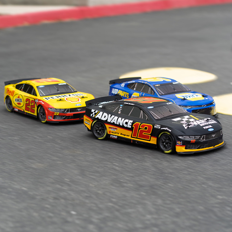 Losi NASCAR RC Race Cars racing on a track