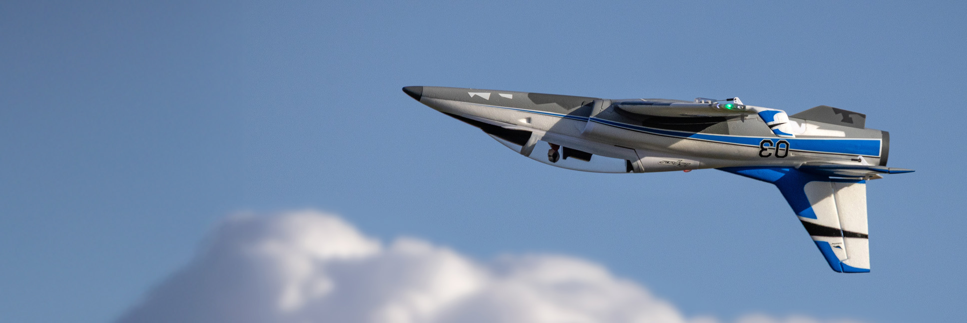 Action shot of the E-flite UMX Viper 30mm EDF RC Jet Bind-N-Fly Basic with AS3X and SAFE Select flying upside down through the sky