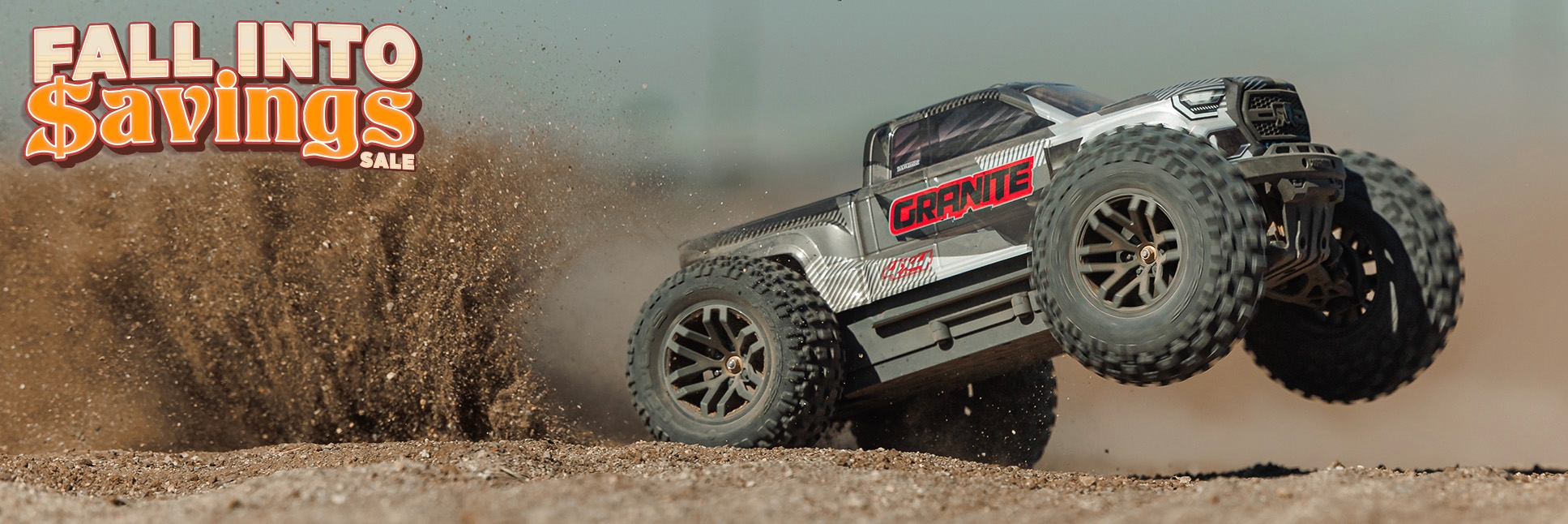 Action Shot of the ARRMA 1/10 GRANITE 223S 4X4 Ready-to-Run Brushless RC Monster Truck doing a wheelie through sand and dirt with the Fall Into Savings RC Sale Logo