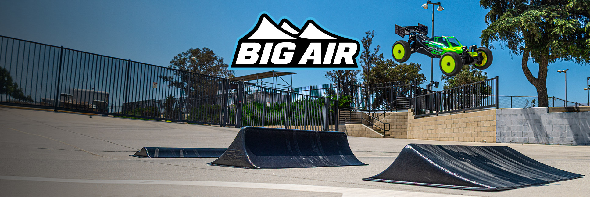 Pro-Line Big Air Triple RC Ramp Set with action shot of an RC Buggy in mid air