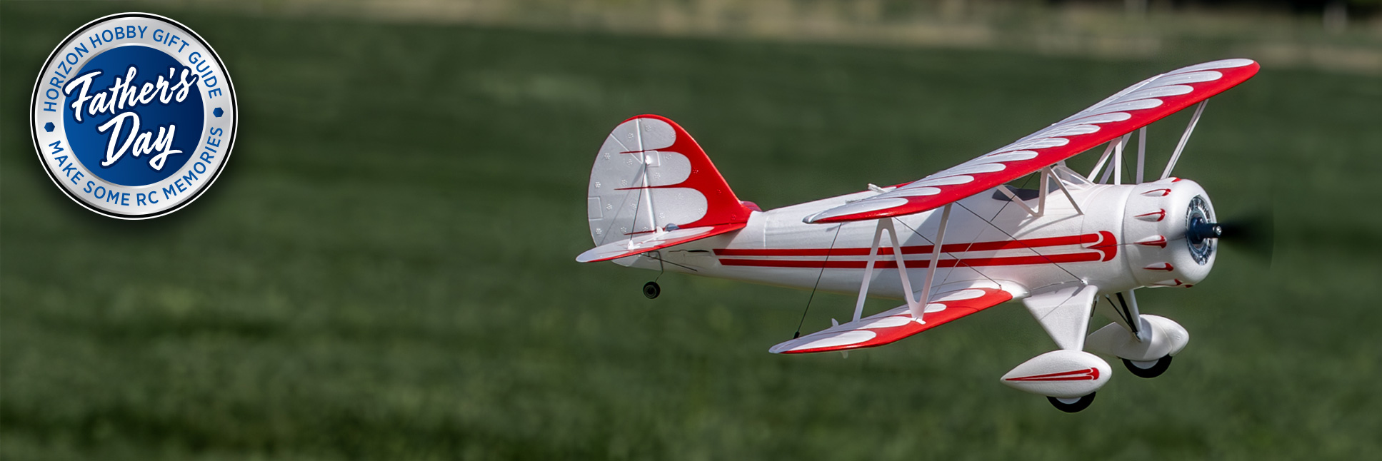 Action Shot of white E-flite UMX WACO Bind-N-Fly Basic AS3X and SAFE Select with Horizon Hobby Father's Day 2025 Logo Action Shot of white E-flite UMX WACO Bind-N-Fly Basic AS3X and SAFE Select with Horizon Hobby Father's Day 2025 Logo