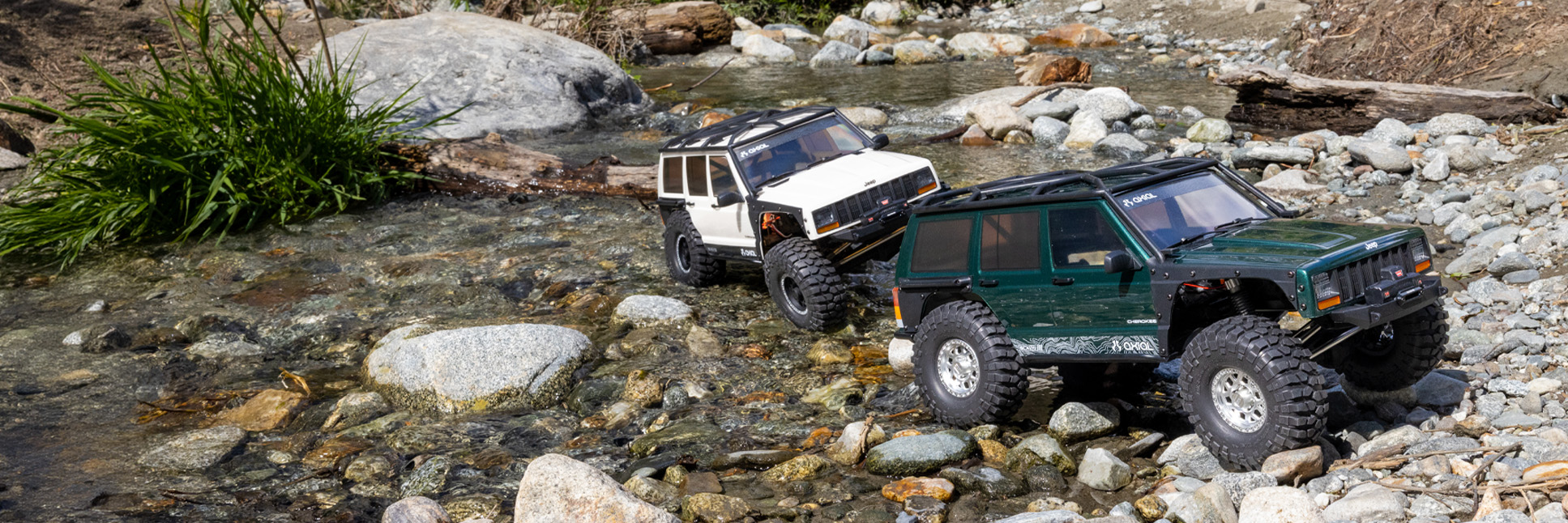 Action shot of the 1/10 Axial SCX10 III Jeep Cherokee XJ climbing over rocks