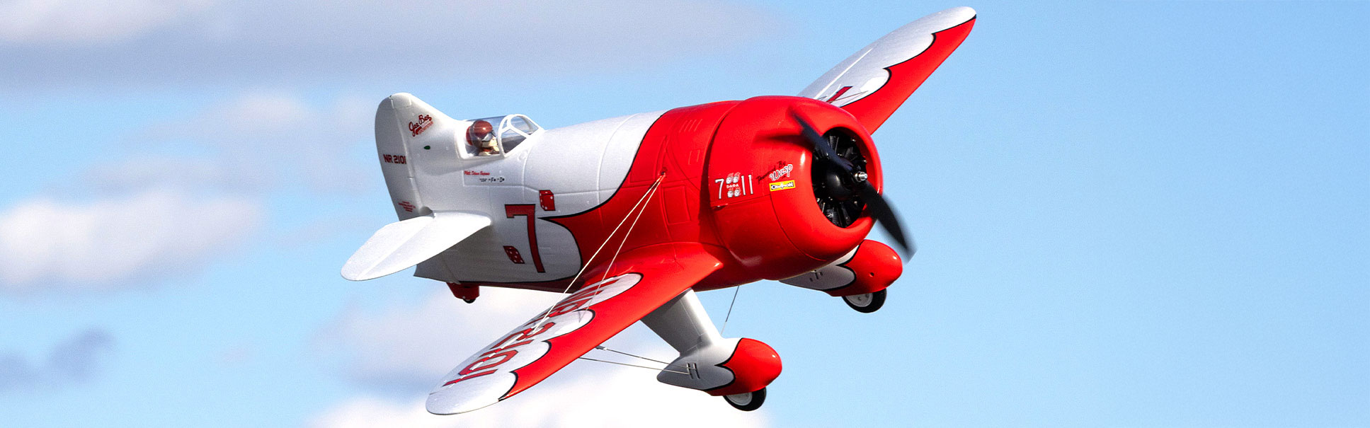 Order the E-flite Gee Bee R-2 1.0m RC Airplane RC Airplane now! Action shot of the E-flite Gee Bee R-2 1.0m RC Airplane flying through the air with a sky background
