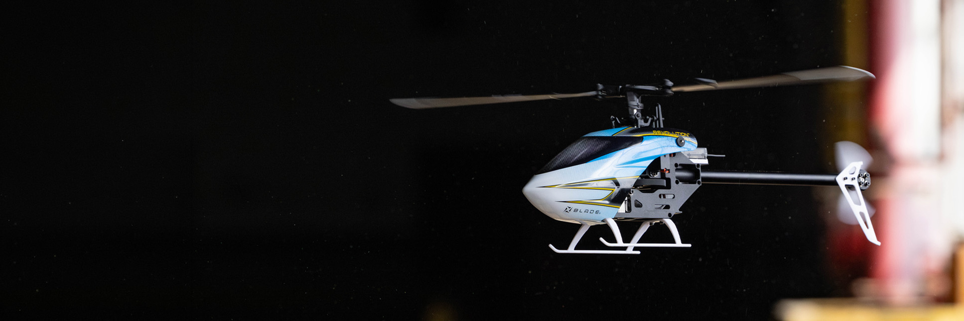 Action shot of the Blade Revolution 155 CP RC helicopter hovering in the air