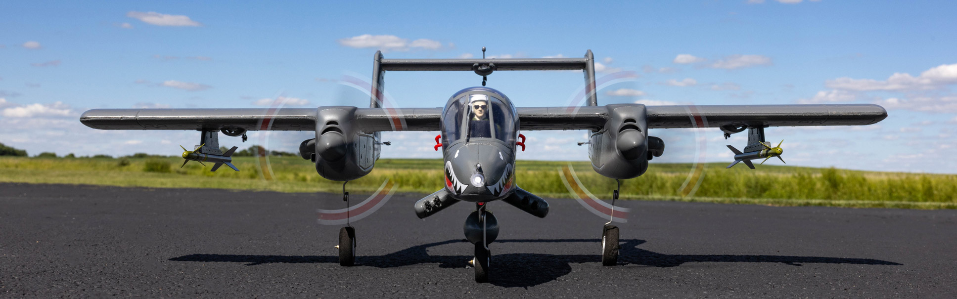 Action shot of the E-flite Micro OV-10 Bronco 645mm Bind-N-Fly Basic with AS3X and SAFE Select RC aircraft on a tarmack