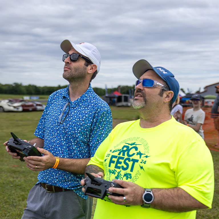 RC Pilot teaching a child to fly an RC Airplane