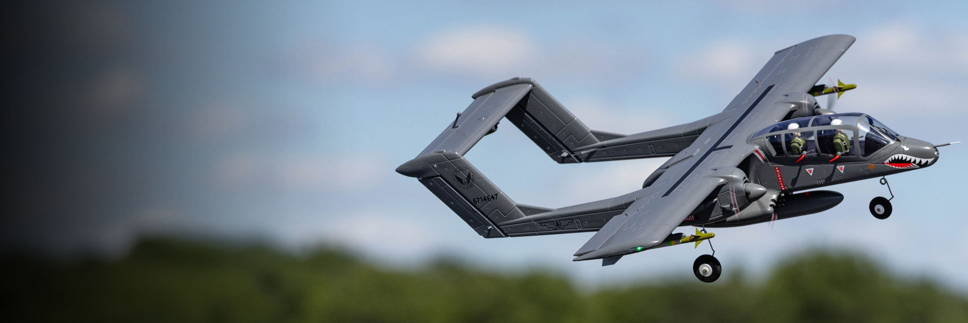 Action shot of the E-flite Micro OV-10 Bronco 645mm Bind-N-Fly Basic with AS3X and SAFE Select RC military aircraft flying through the air Action shot of the E-flite Micro OV-10 Bronco 645mm Bind-N-Fly Basic with AS3X and SAFE Select RC military aircraft flying through the air