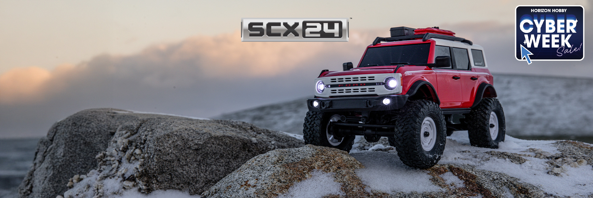 Glamour shot of the Axial 1/24 SCX24 Ford Bronco 4X4 Ready-to-Run Brushed RC Rock Crawler with the Cyber Week Sale Logo Glamour shot of the Axial 1/24 SCX24 Ford Bronco 4X4 Ready-to-Run Brushed RC Rock Crawler with the Cyber Week Sale Logo