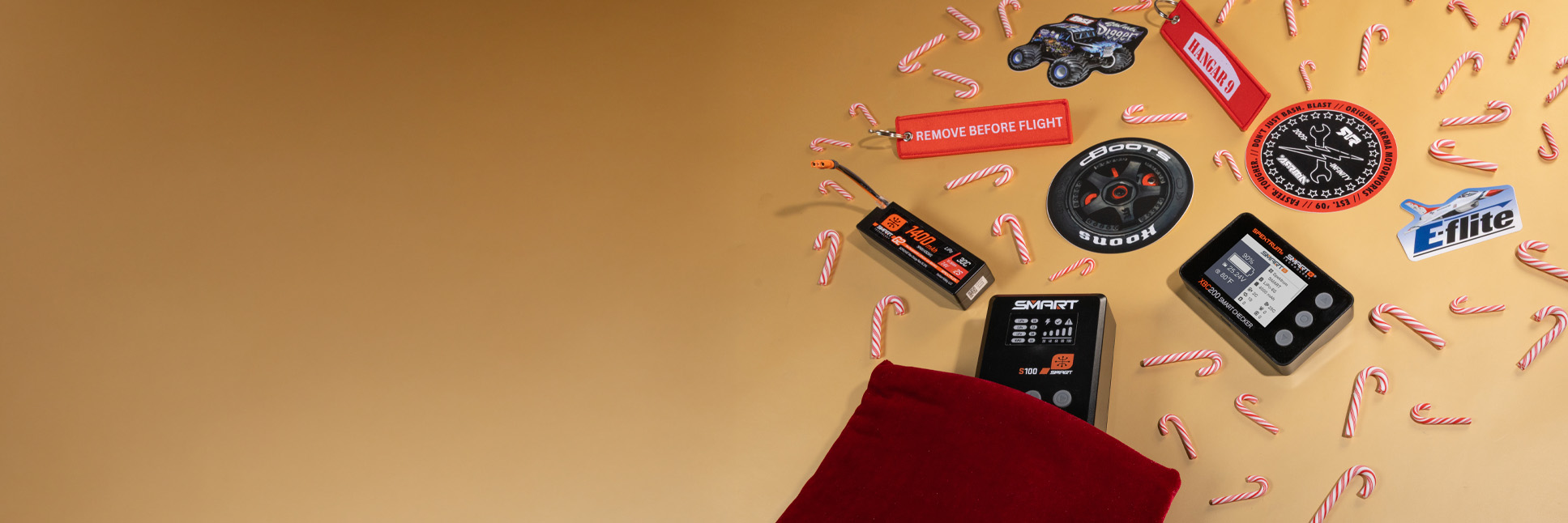 Stocking Stuffer Graphic group shot of RC accessories and stickers with a festive holiday themed background