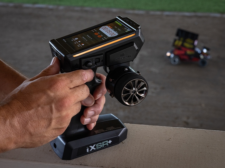 Lifestyle shot of the Spektrum iXSR+ 12-Channel DSMR+ Transmitter