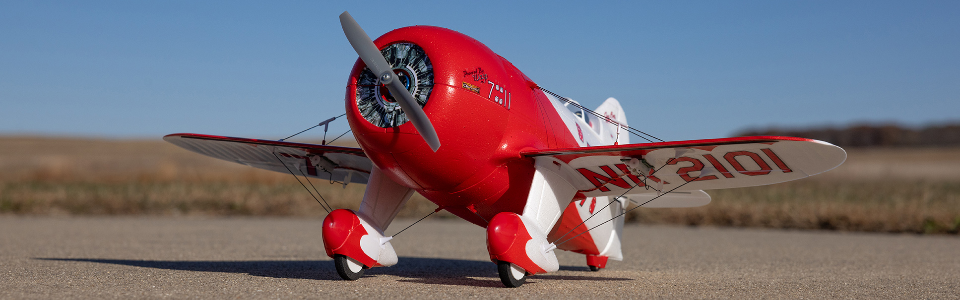 Order the E-flite UMX Gee Bee R-2 510mm Bind-N-Fly Basic RC Plane with AS3X and SAFE Select Now! Action shot of the E-flite UMX Gee Bee R-2 510mm Bind-N-Fly Basic RC Airplane with AS3X and SAFE Select flying through the sky