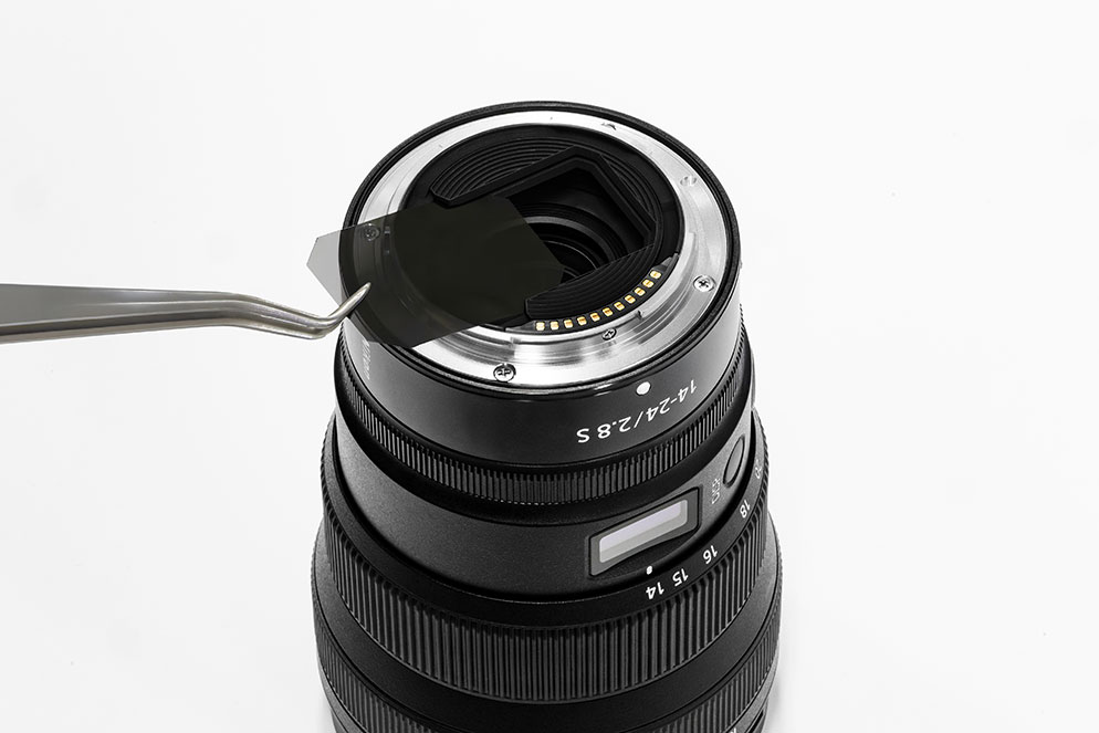 rear view of the NIKKOR Z 14-24mm f/2.8 S with a filter being inserted into the rear slot