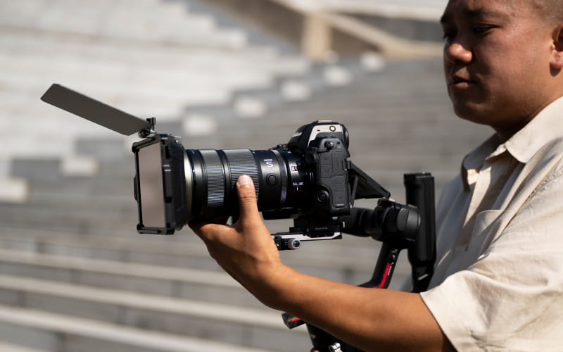 NIKKOR Z 24-70mm f/2.8 S II on a camera on a gimbal showing easy balancing