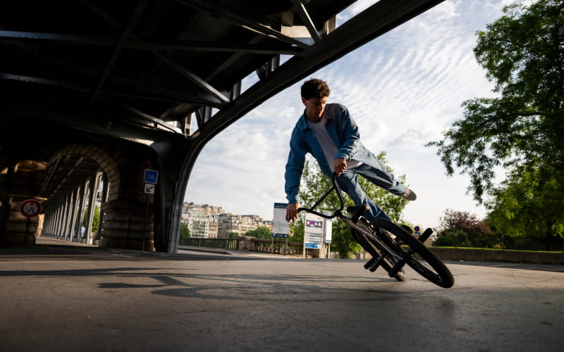 Photo of a bike rider in a city, taken with the NIKKOR Z 24-70mm f/2.8 S II lens