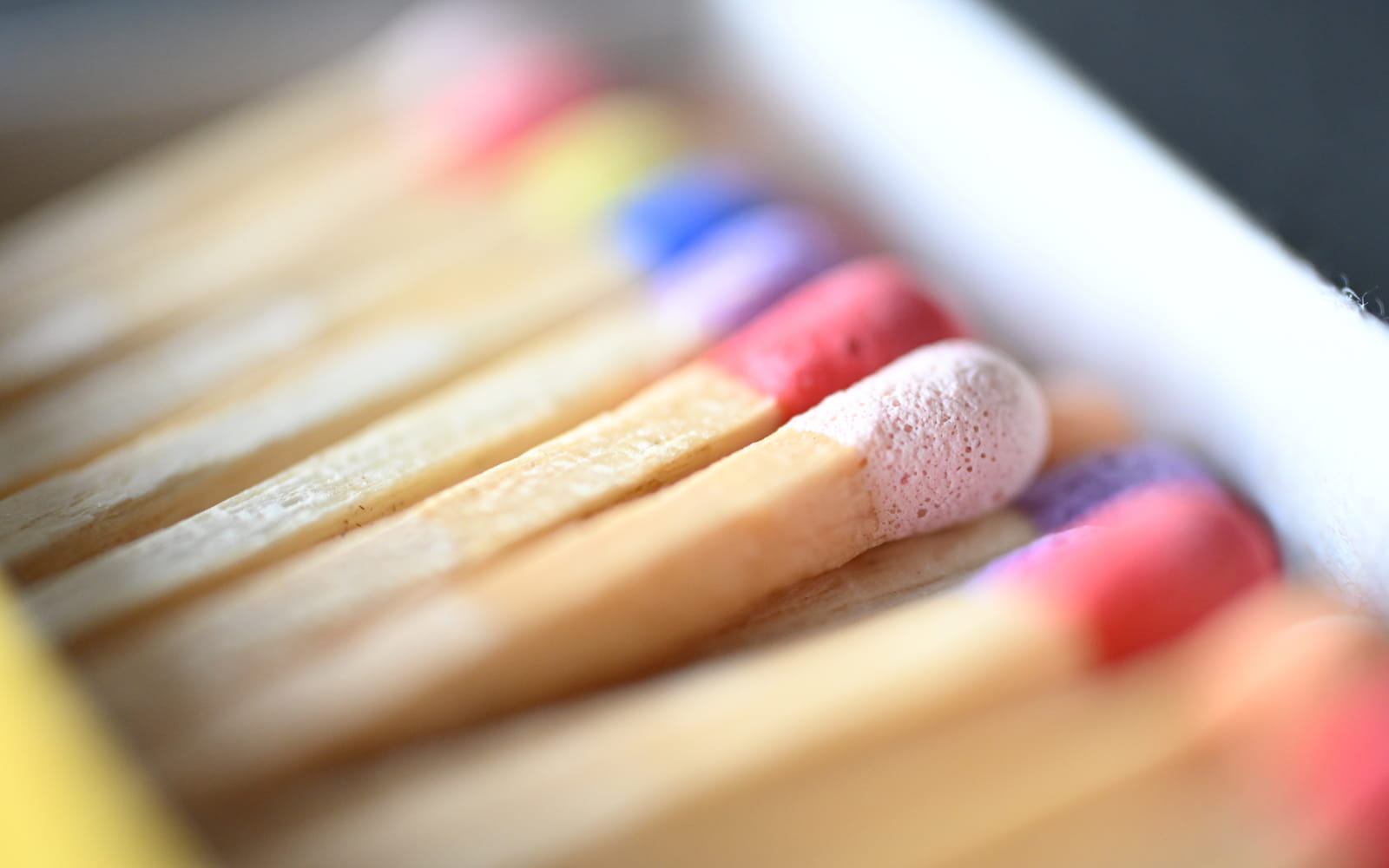 macro photo of colorful matchsticks taken with the NIKKOR Z DX MC 35mm f/1.7 lens