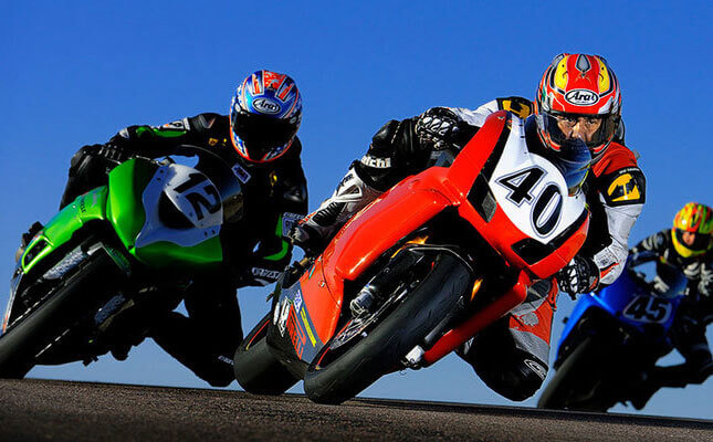Sports action shot of a motorcycle race by Dave Black