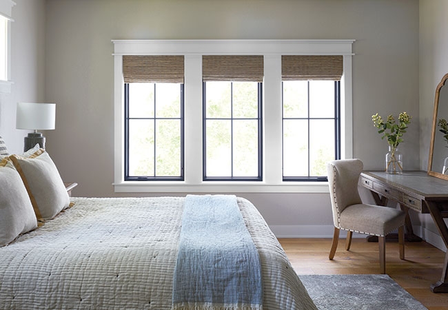 traditional bedroom with three impervia windows