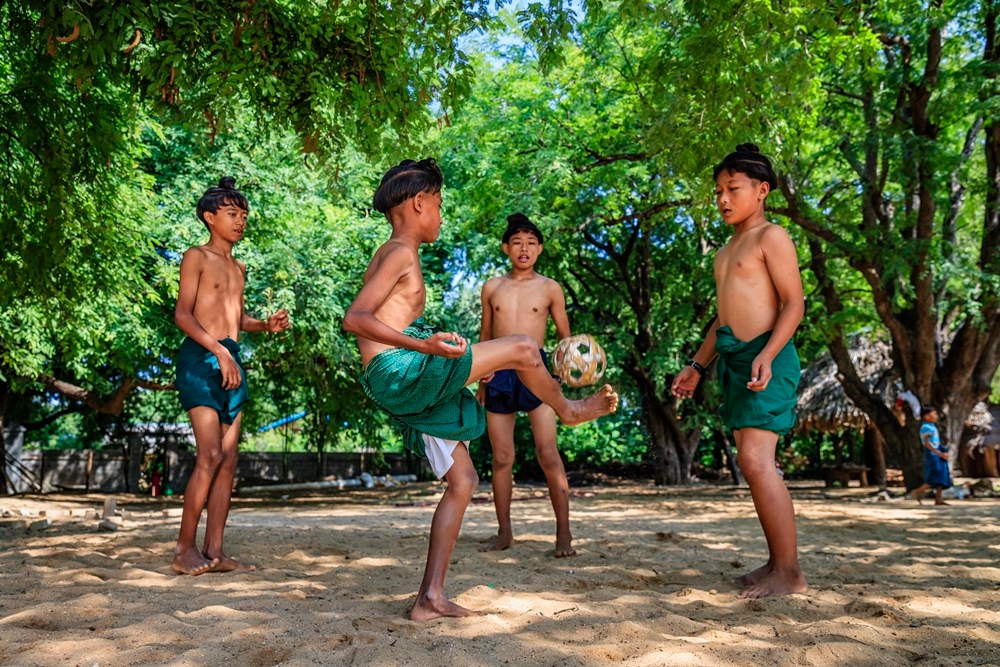 Asian Children Play Soccer In The River,Sport Plays An Important Role In  Rural And Regional Thailand,Sport Are The Predominantly Or Exclusively  Played In Rural Areas,Thailand Football. Stock Photo, Picture and Royalty  Free