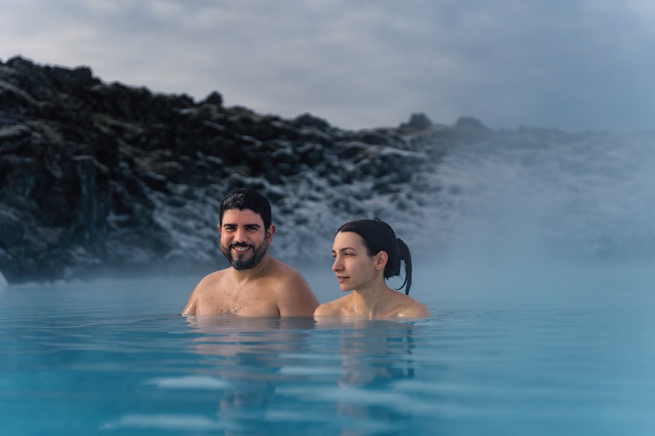 Family_sitting_beside_steaming_thermal_pools_Large.jpeg