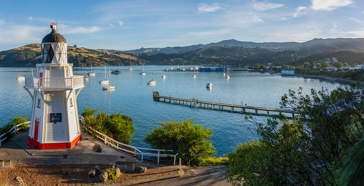 Boats_on_Akaroa_Harbour_French-influenced_village_in_background_(1).jpeg