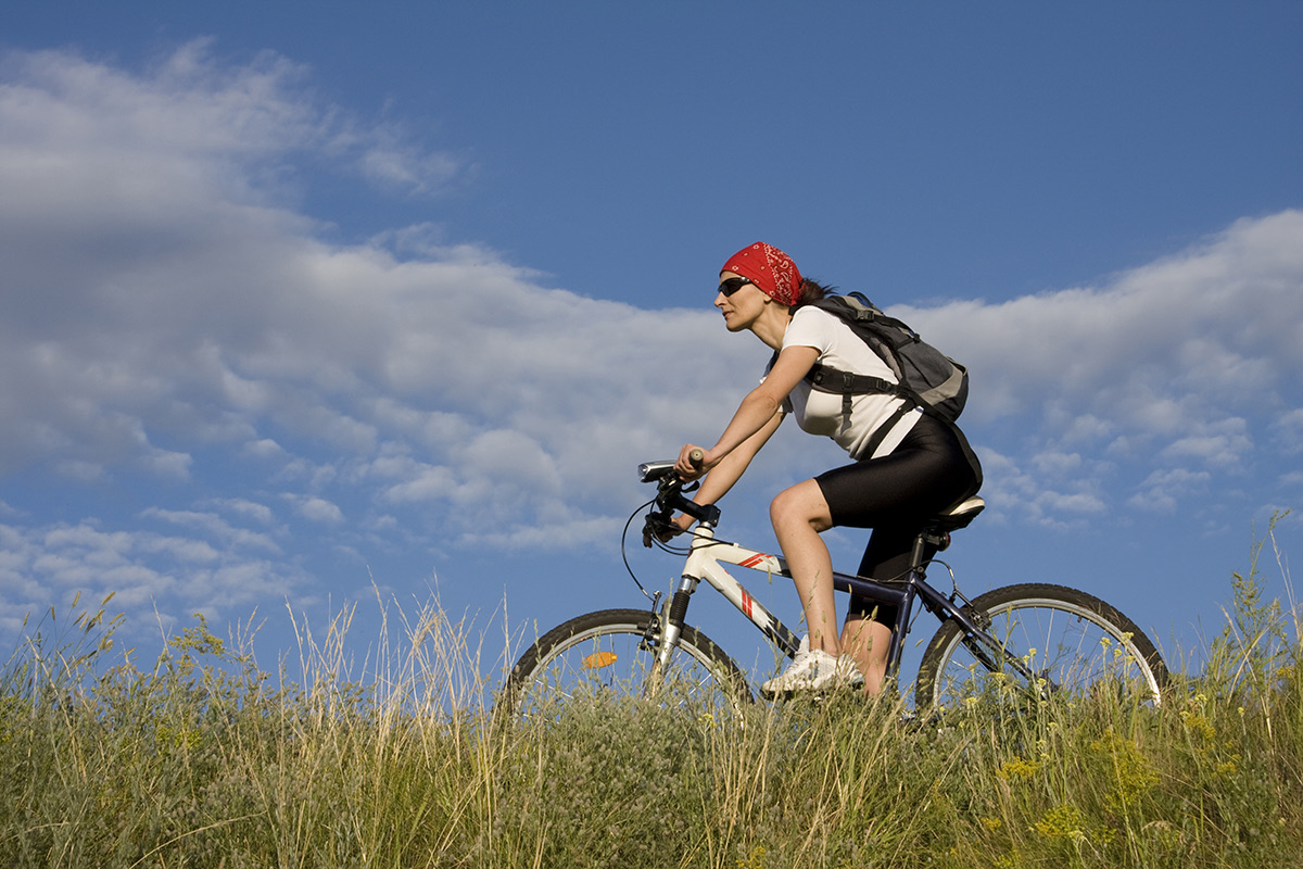 Hiker_or_biker_on_Nydia_Track_forested_trail_with_sea_glimpses._(1).jpeg