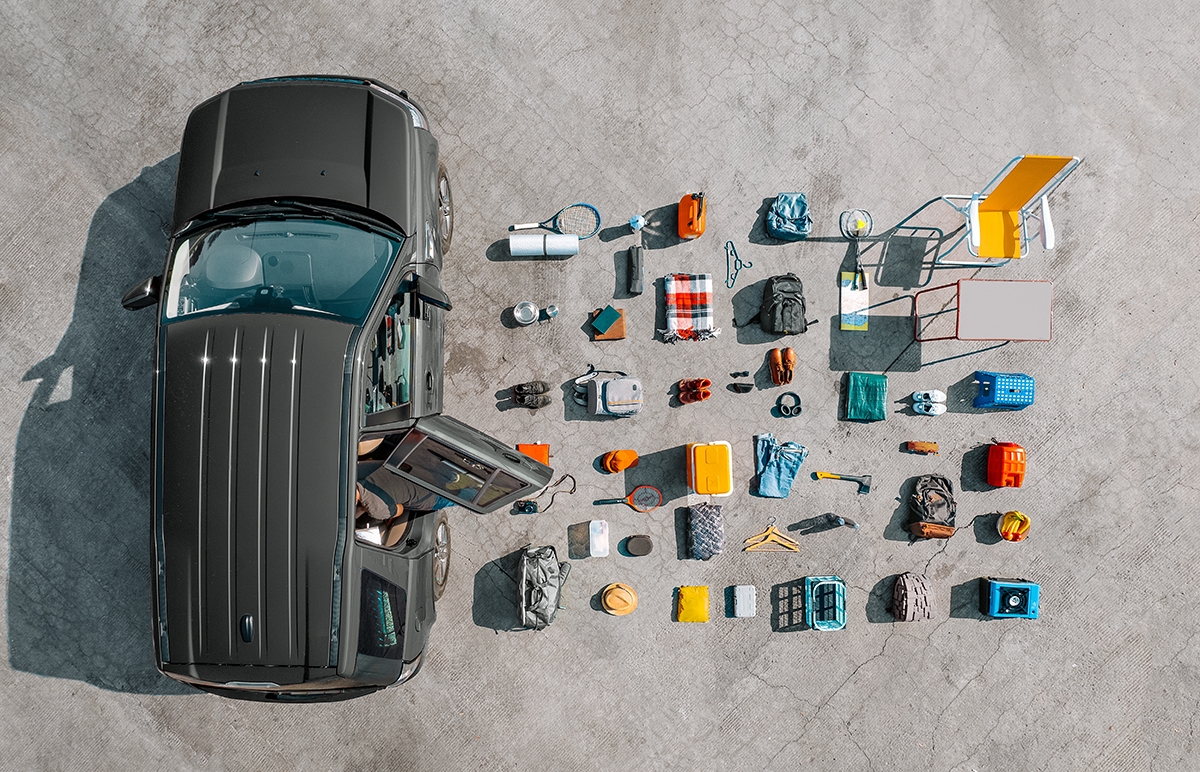 Flat_lay_of_car_travel_essentials_including_sunscreen_charger_snacks_(1).jpg