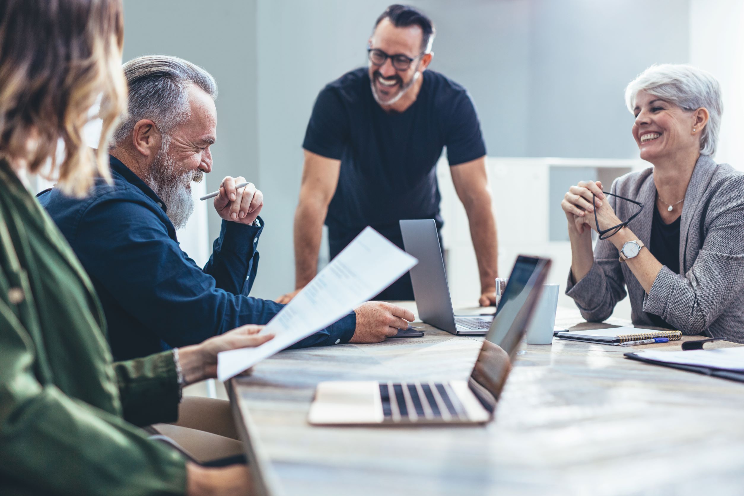 Image of employees in a board room