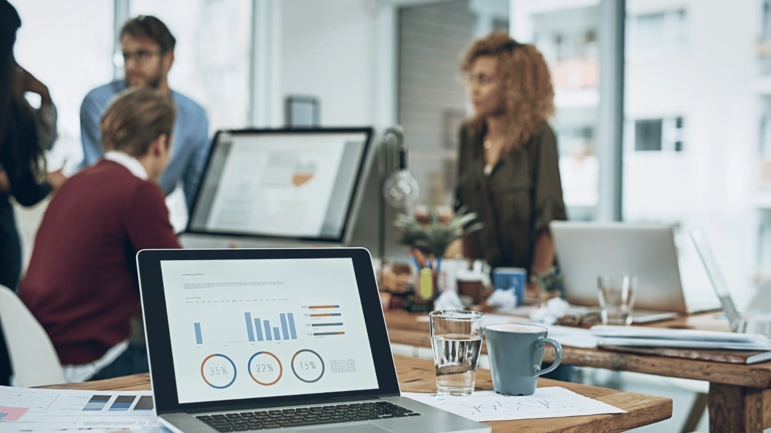 Paralegal typing on laptop