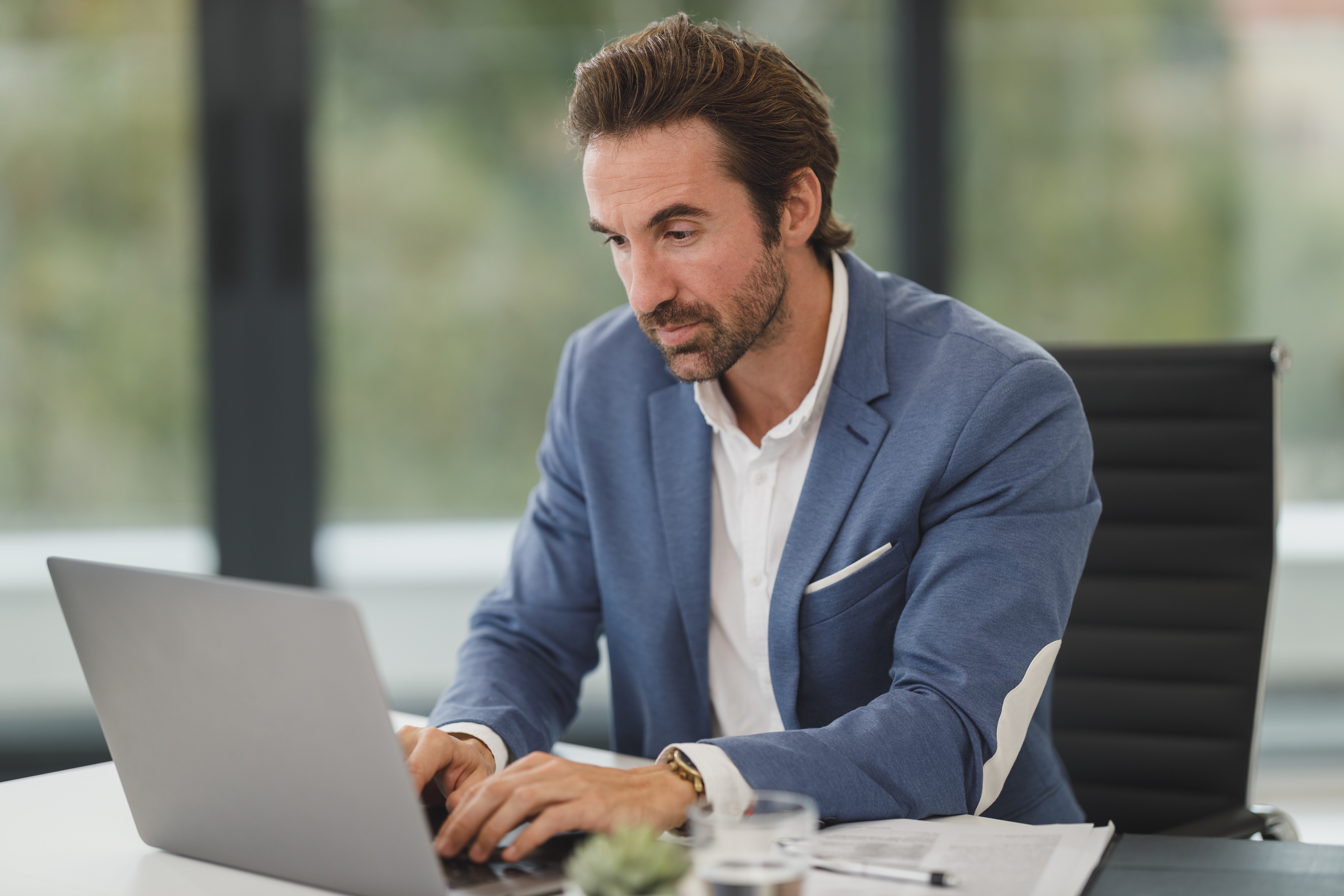 Image of person typing on laptop
