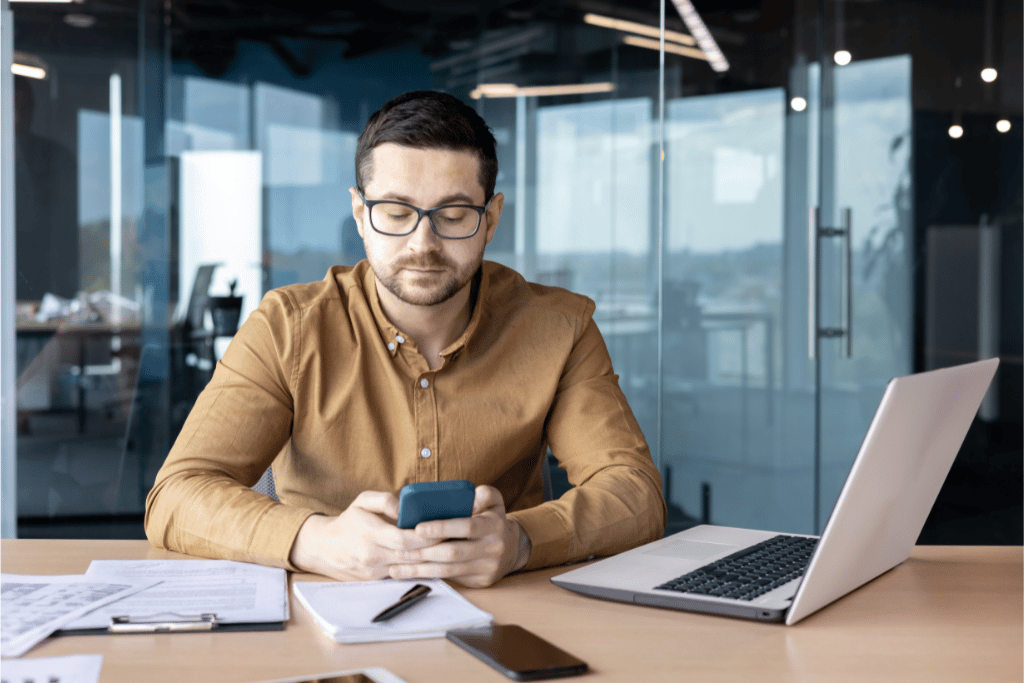 Attorney at desk texting