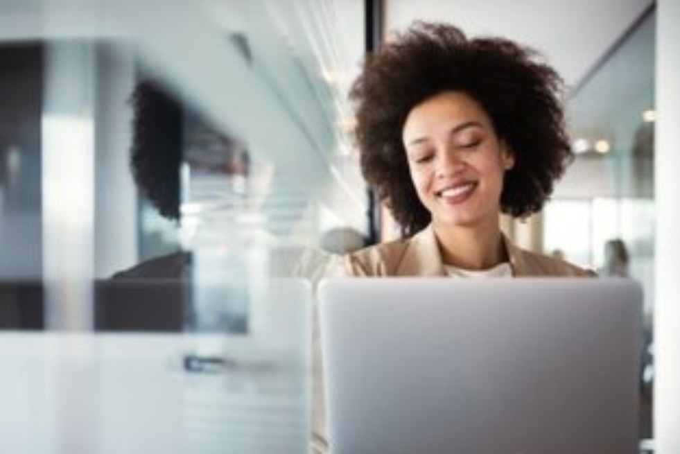 Image of person typing on laptop