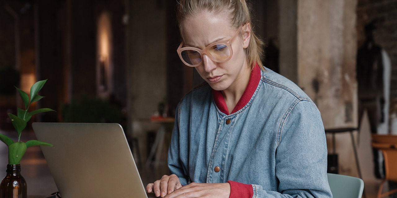 Woman researching on the internet about how to plan her finances.