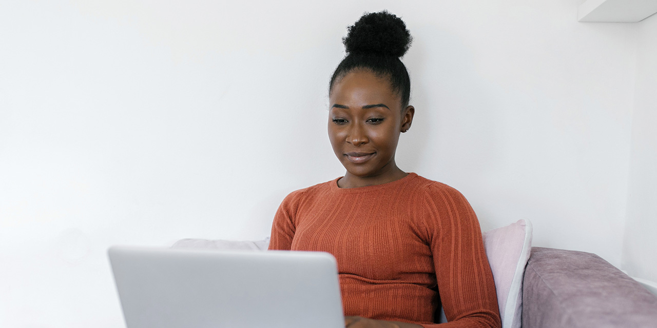 Woman researching ways to automate her finances online