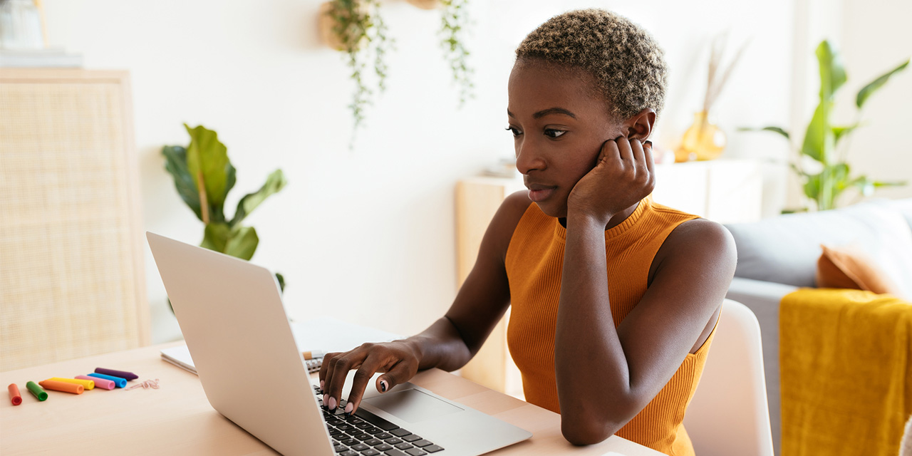 Woman using her computer to for personal budgeting