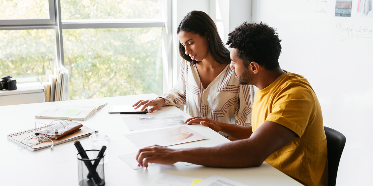 Couple at home researching about credit reports