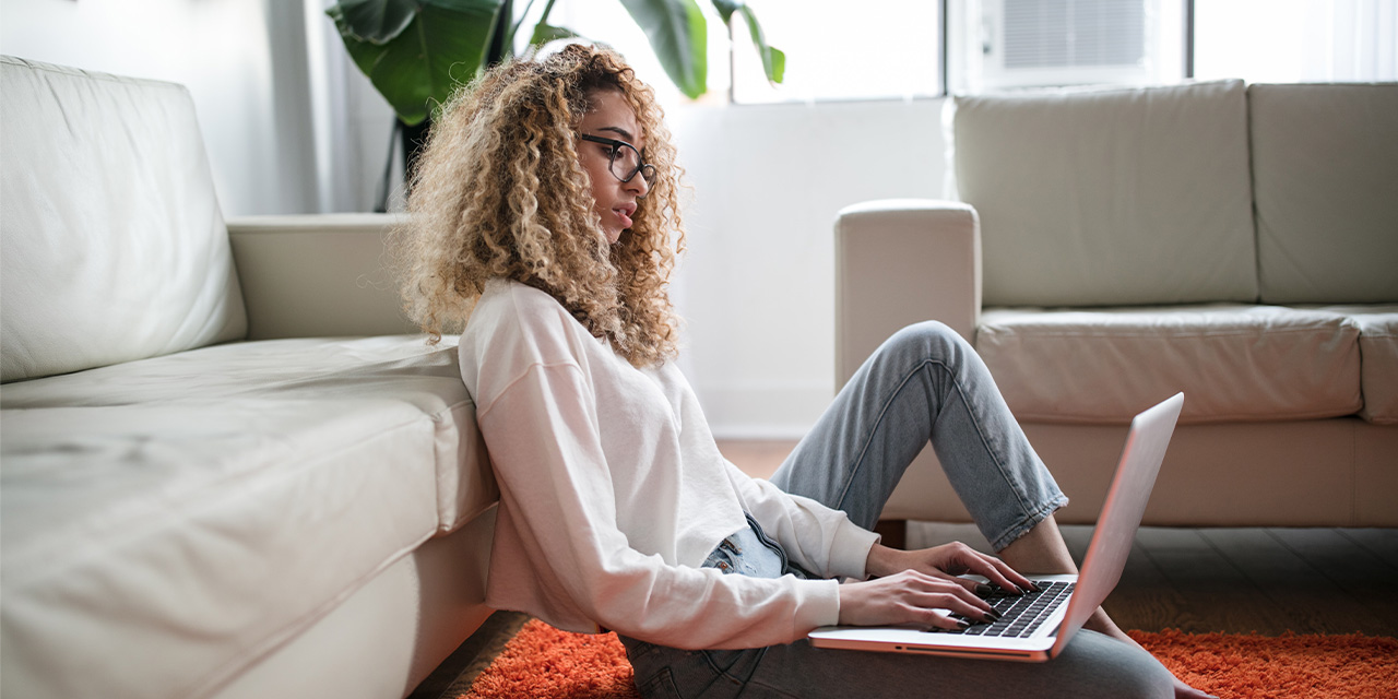 Woman on laptop filing her taxes for free