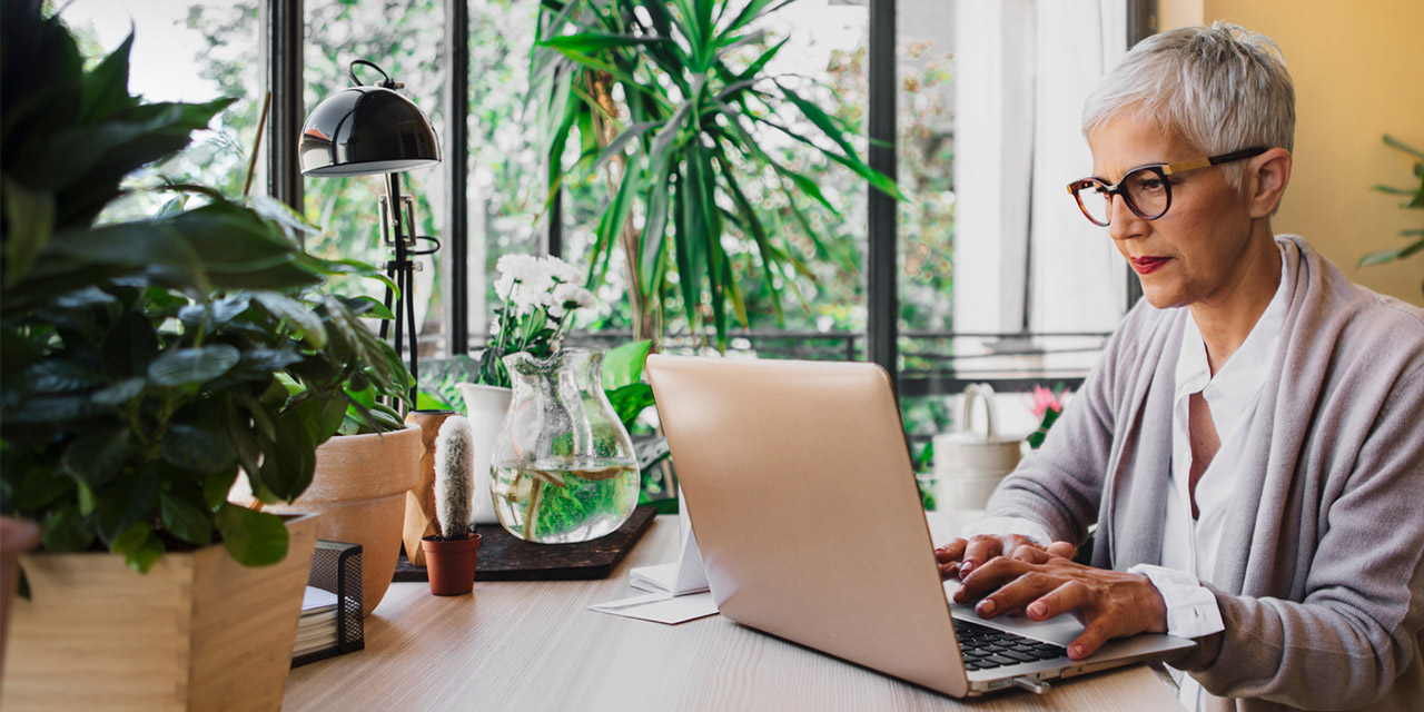 Woman researching online to learn about rainy day fund myths