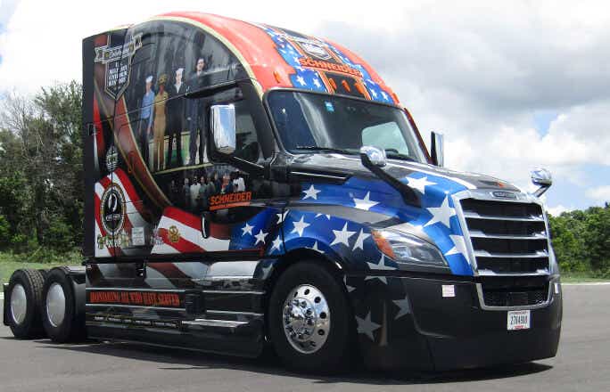 Schneider's new Ride of Pride truck is decorated with bold decals featuring patriotic and military images