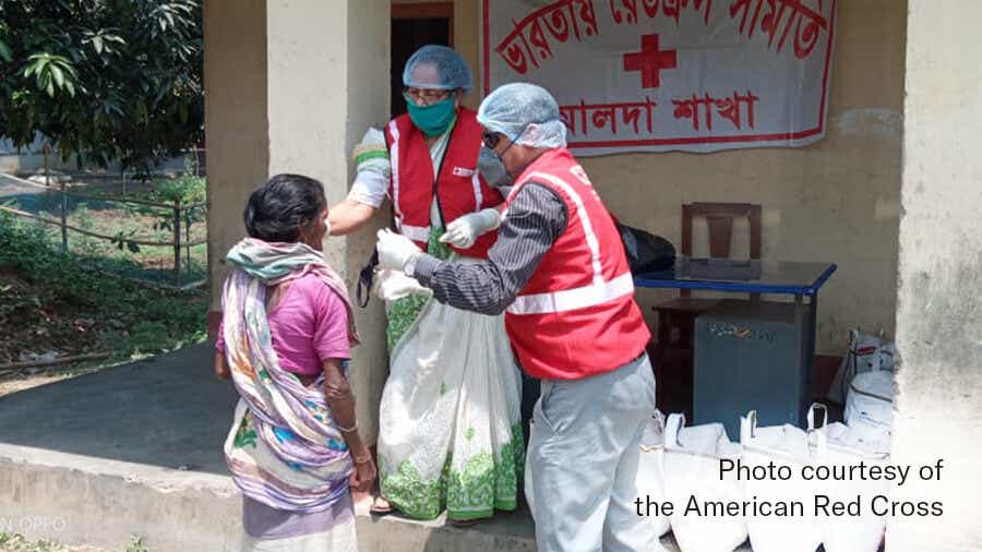 Volunteers work COVID-19 relief in India.