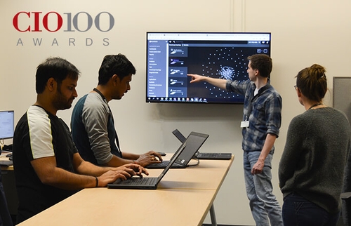 Image of Schneider associates assessing technology advancements and ongoing enhancements for carriers, shippers and Schneider associates.