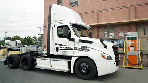 Schneider truck parked at charging dock.