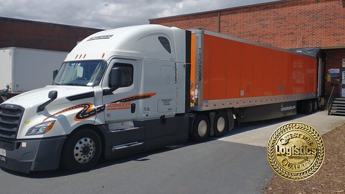 Schneider truck parked at loading dock.