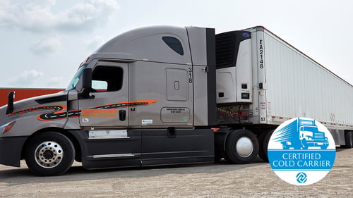 A Schneider tracter hauling a refrigerated trailer with the Certified Cold Carrier logo in the bottom right of the image
